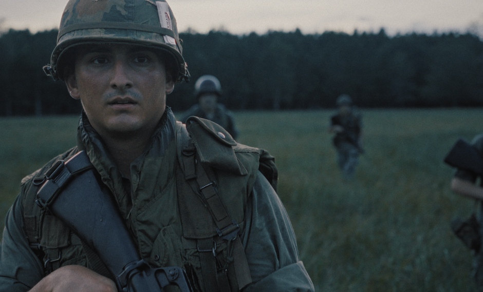 soldiers walking through field